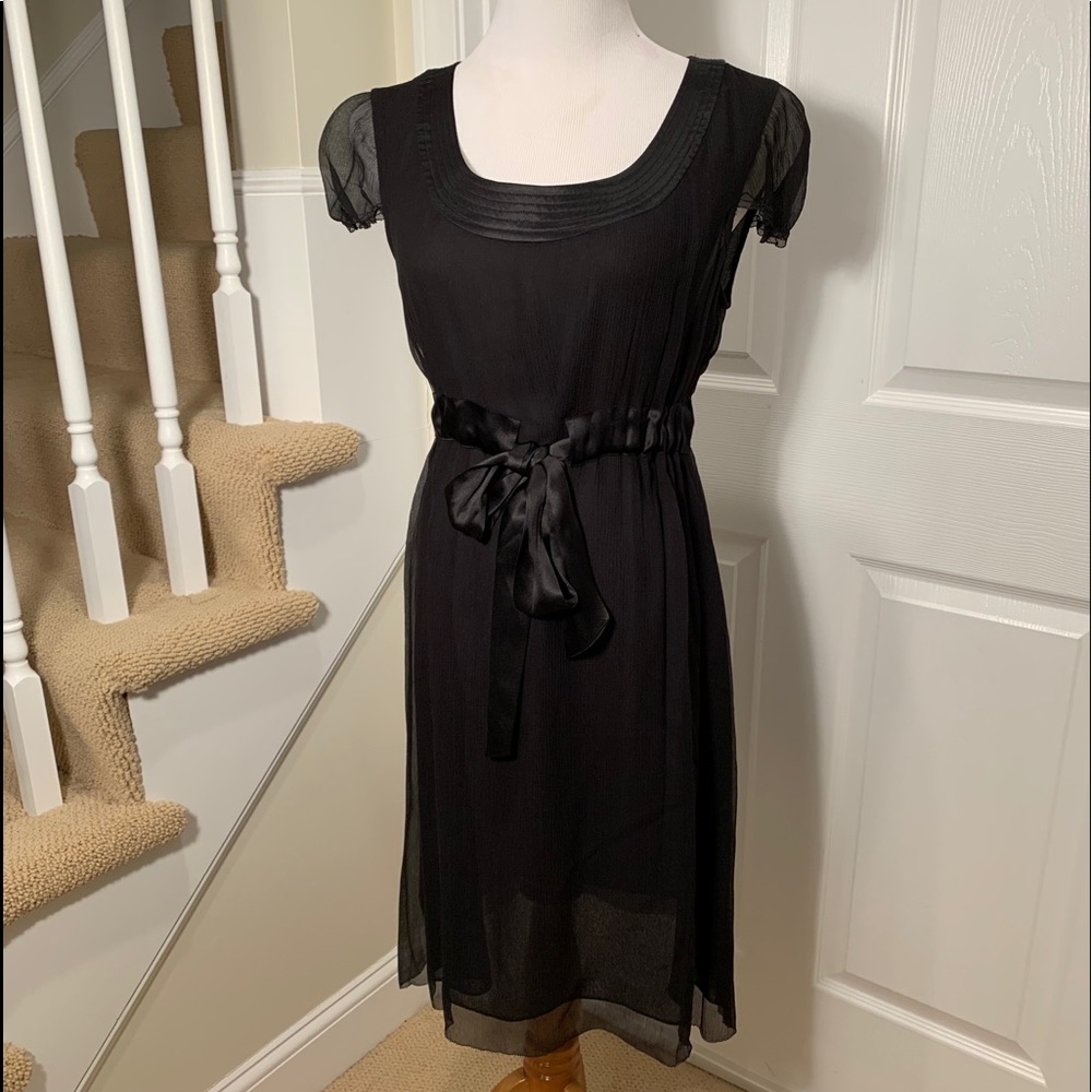 Perfect condition. Black silk dress. Tie detail